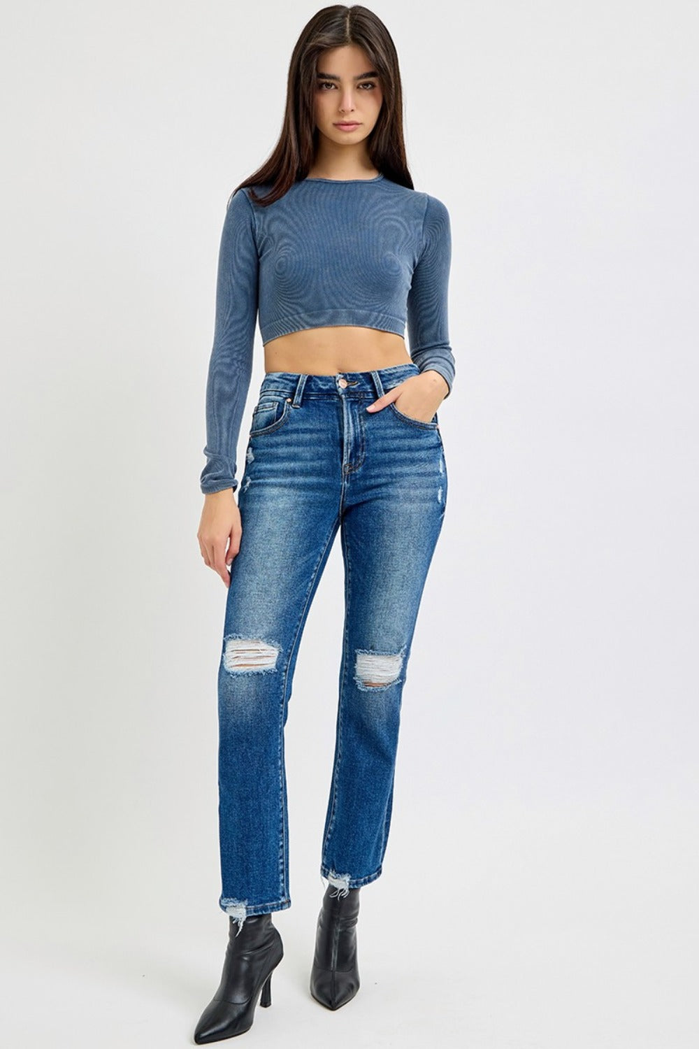 High Rise Distressed Crop Straight Jeans in dark wash with a high-rise fit, distressed details, raw hem, and slightly stretchy fabric for a cool, versatile look.