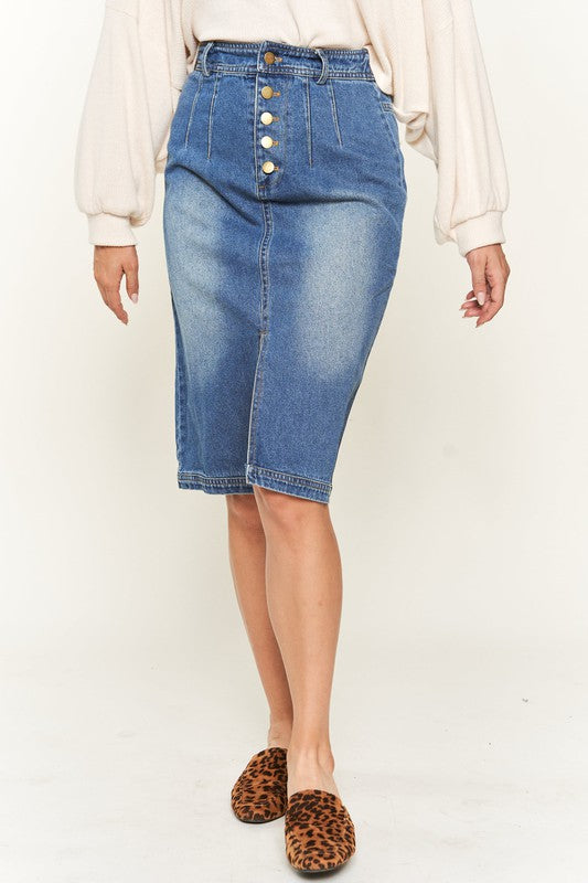 Denim button-down midi skirt with a front slit, belt loops, and back pockets. Features a high waist with an elasticized waistband in the back.