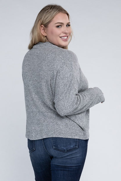Plus size model wearing Raya Curvy Plus Drop Shoulder Top in heather gray with mock neck.