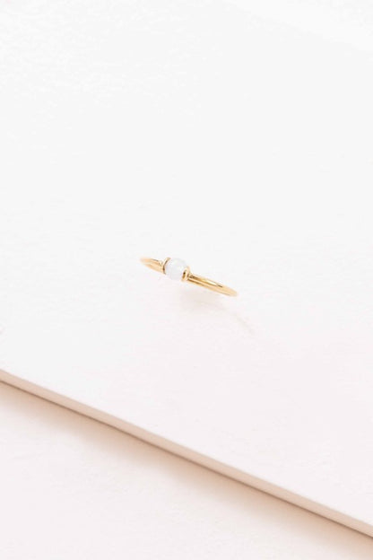 Becca White Stone Ring top view showing thin gold band and centered white stone detail