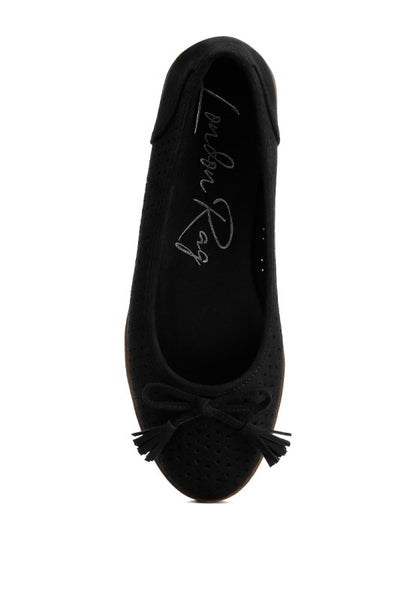 Top view of black Pacer vegan leather ballerina flat displaying the perforated pattern and centered bow embellishment.