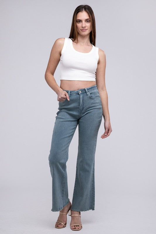 Teal acid-washed straight wide-leg pants featuring a frayed cutoff hem, zip fly closure, and a relaxed fit. Made with stretchy fabric for comfort and a unique vintage-inspired look.