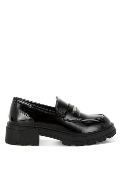 Medial side view of Black Gleam Stride Chunky Loafers showing cushioned insole and block heel.