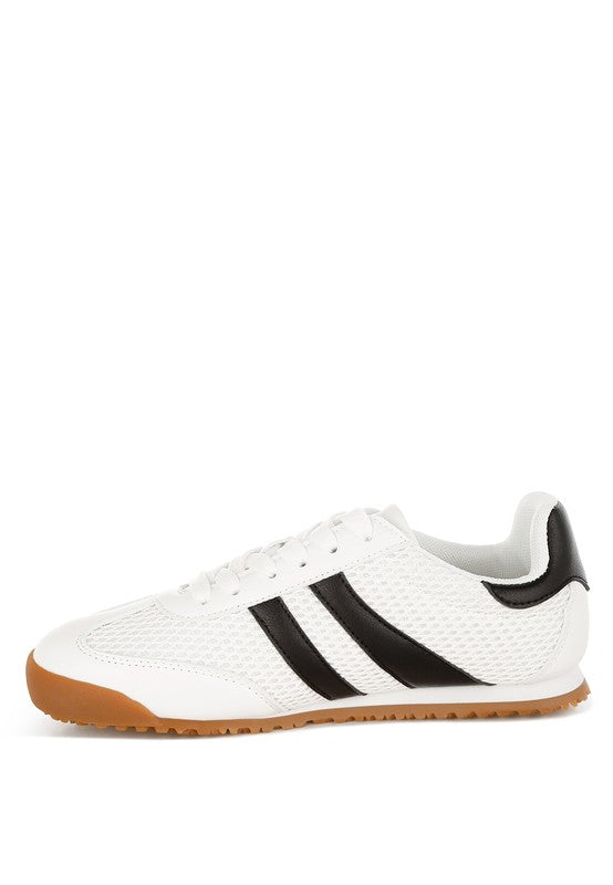 Inside angle view of white Blaster sneaker with black stripes, featuring mesh upper and lace-up design – casual athletic style by Rag Company