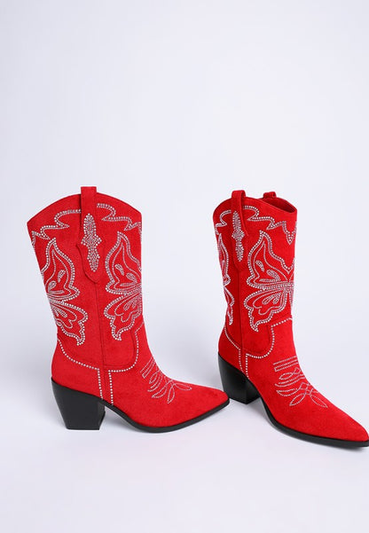 Pair of red cowboy boots with rhinestone butterfly embellishments