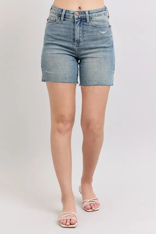 Front view of Sia high waist denim shorts in vintage wash with side slits, raw hem, and classic five-pocket design.