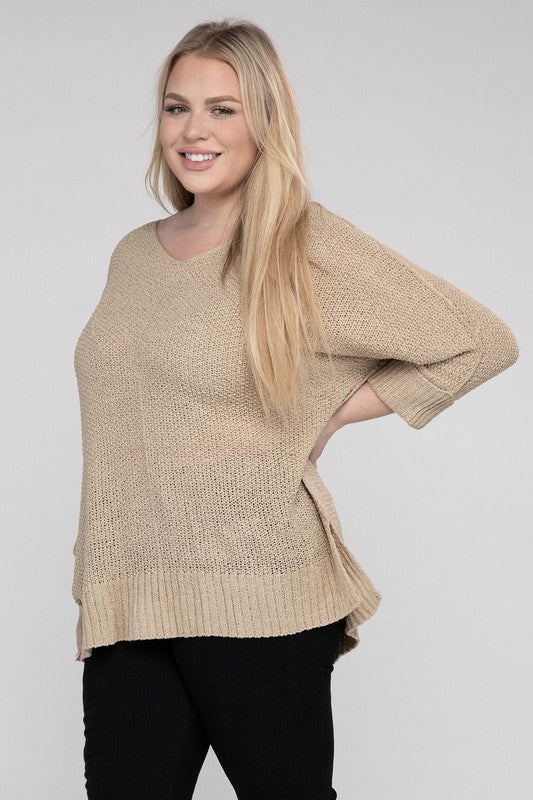 Oatmeal plus size crew neck sweater with a loose fit, side slits, long sleeves, and a cozy knit fabric for warmth.