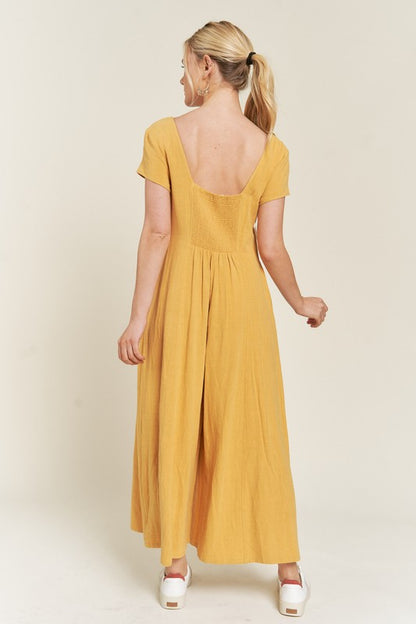 Mustard Seona Linen Plus Size Jumpsuit back view with wide cropped legs and relaxed fit.