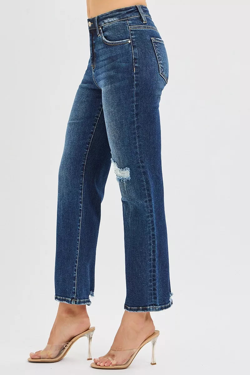 Side angle of Jenna High Rise Crop Slim Straight Jeans highlighting cropped raw hem.