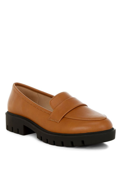 Peridot Chunky Loafers in tan showing sleek silhouette and classic penny strap design.