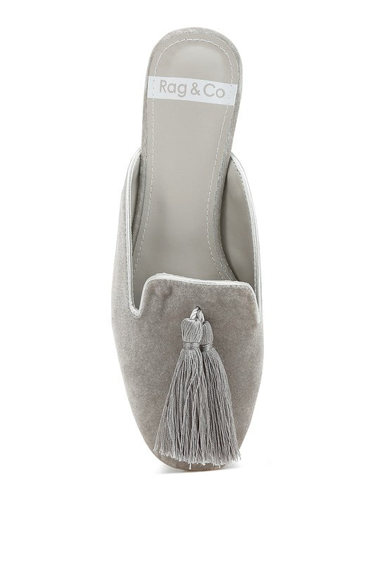 Silver mules with velvet upper and tassel detail.