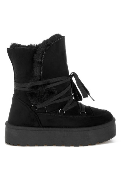 Side angle of Black Noaya Chunky Faux Fur Snow Boots showing chunky lug sole and flatform heel.