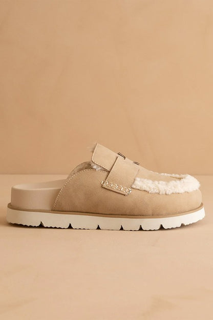 Side view of Avalon Khaki suede loafer mules with shearling trim, low heel, and rubber sole.