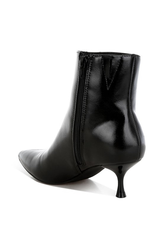 Black faux leather kitten heel boots with a closed point toe, 2.5-inch heel, and zipper fastening. Features paneling detail, elasticated gussets, and comfortable cushioned insoles.