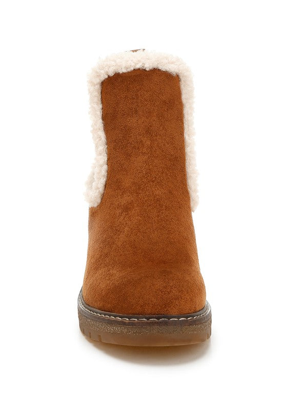 Front view of tan Thunderhoof Boots with round toe and soft faux fur lining.