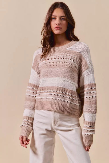 Model wearing Bina Variegated Stripe Textured Sweater Top in taupe with ribbed knit design.