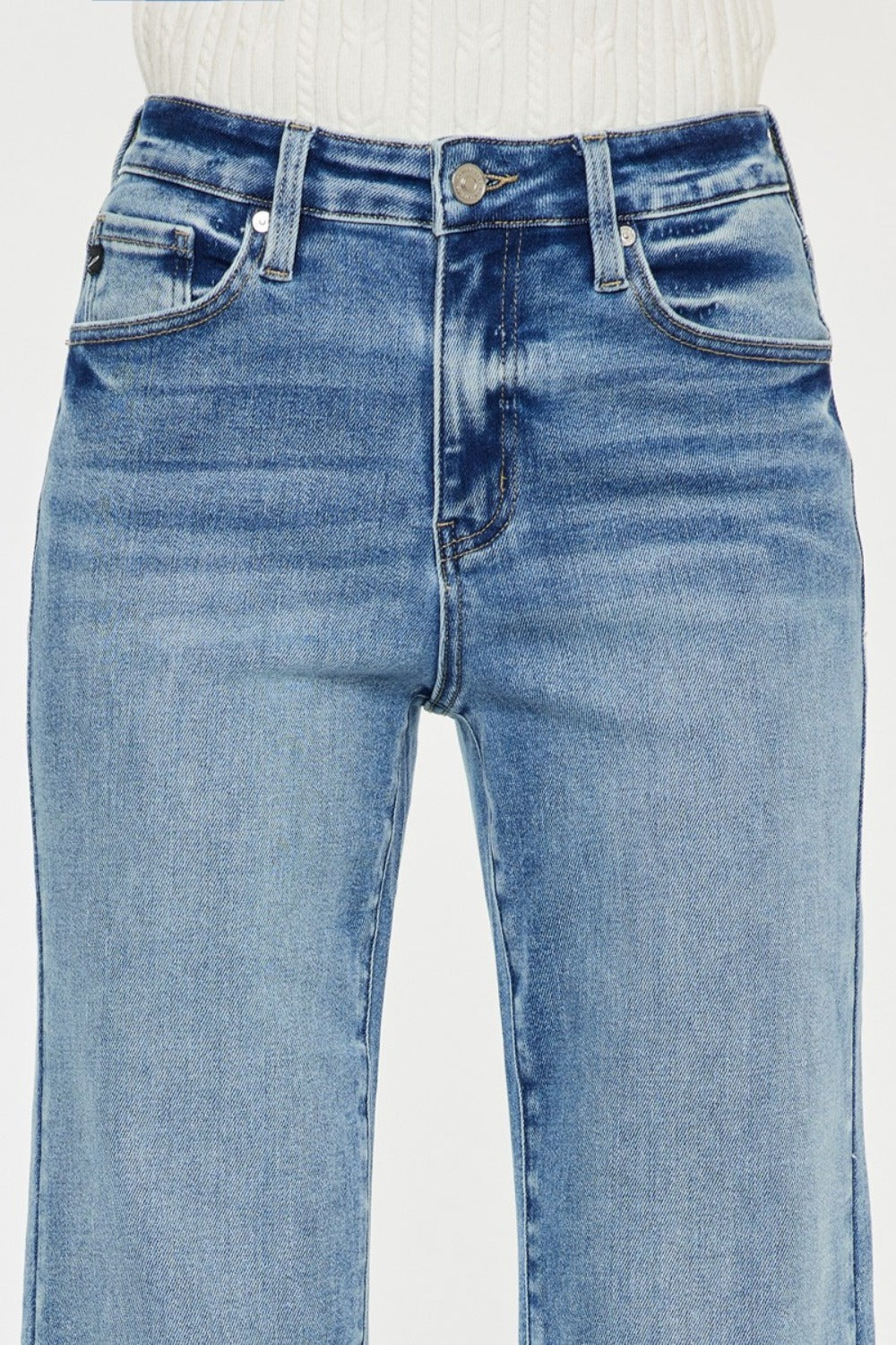 High Rise Wide Leg Jeans in medium wash by Kancan. Slightly stretchy denim with classic 5-pocket design, regular hem, and zipper fly. Versatile wide-leg flare silhouette.