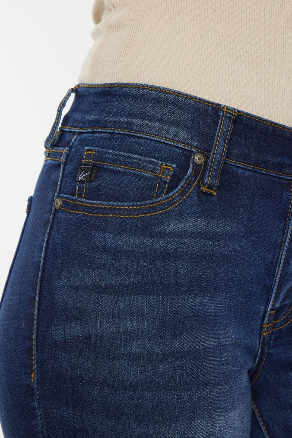 Mid rise gradient skinny jeans with a dark wash. Slightly stretchy, with pockets and a zip fly closure.