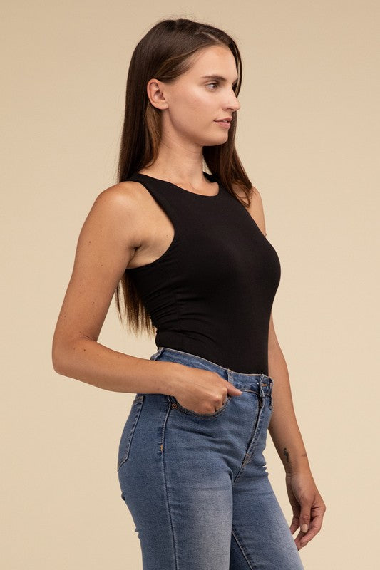 Sleeveless bodysuit in black with a boat neckline, padded bodice, and removable bra pads for adjustable comfort.