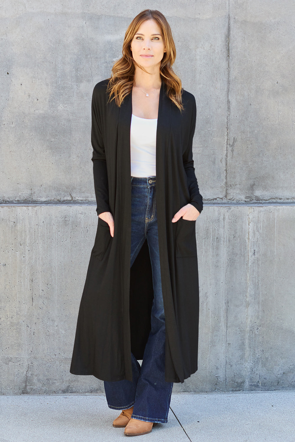 Black open-front long-sleeve cover-up with a flowy design and pockets, perfect for layering on breezy days.