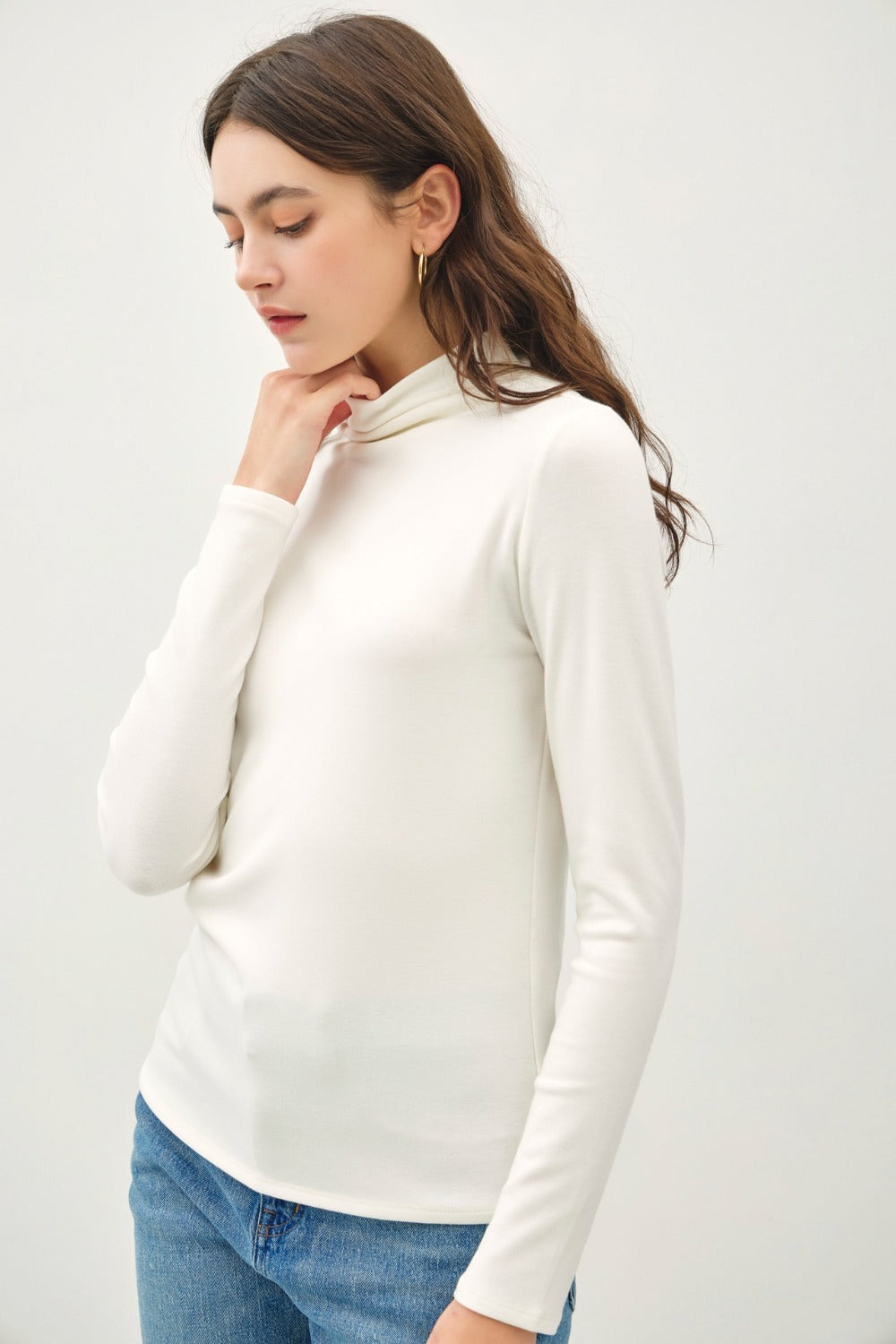 Ivory mock neck long sleeve t-shirt in soft, stretchy fabric.