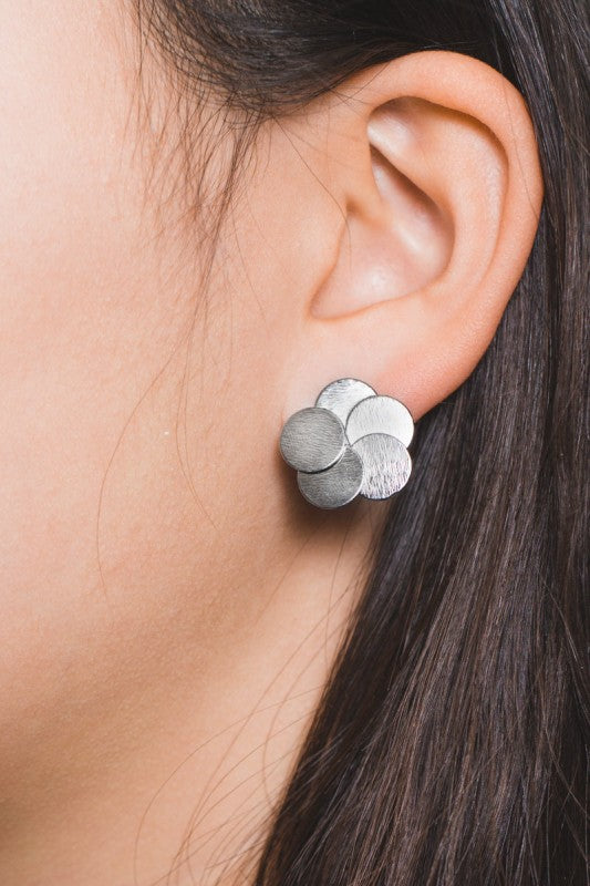 Woman wearing  Round and Round Earrings in Gunmetal earrings.