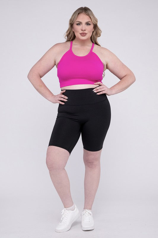 High-rise plus-size athletic biker shorts in black, featuring a fitted silhouette and seamless design for comfort and flexibility.