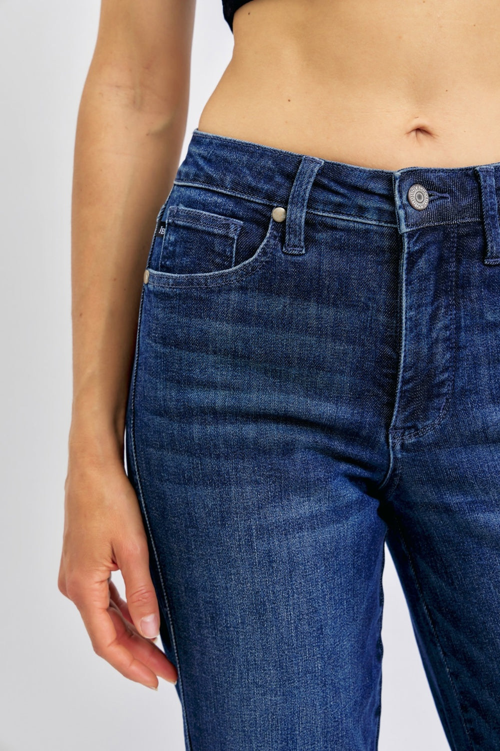 High-waist straight-leg jeans with tummy control, moderate stretch, and a washed finish.