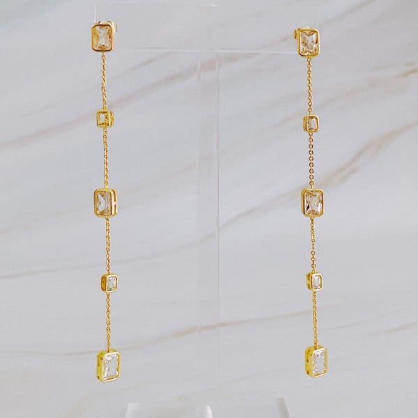 Clear Five Stones Dangle Drop Earrings displayed vertically to show length