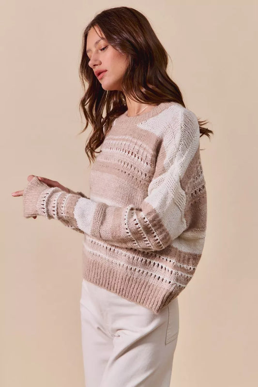 Side view of Bina Variegated Stripe Sweater highlighting relaxed fit and openwork texture.