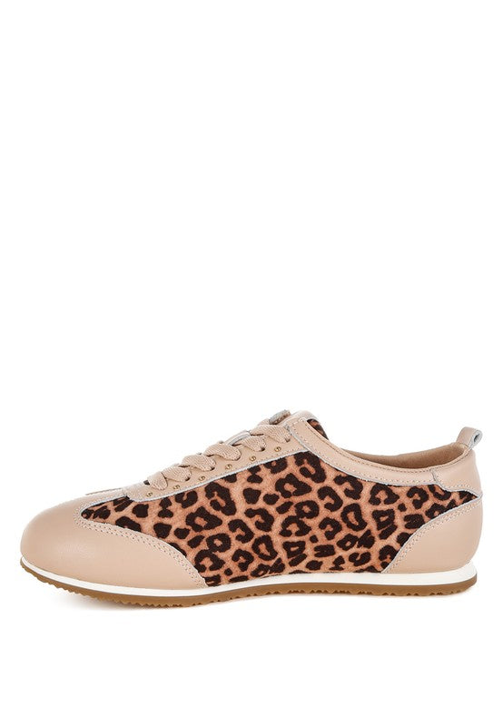 Leopard print and beige genuine leather sneakers inside side view showing studded panels and flatform sole.