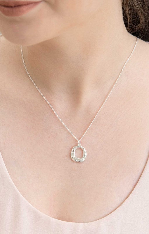Woman wearing Charming Circle Necklace in Silver close up view