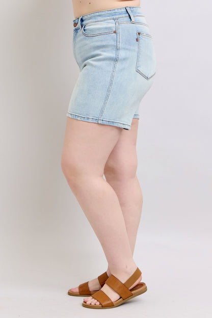 Plus-size side angle of Hannah 2-Button Denim Shorts showing stretch denim.