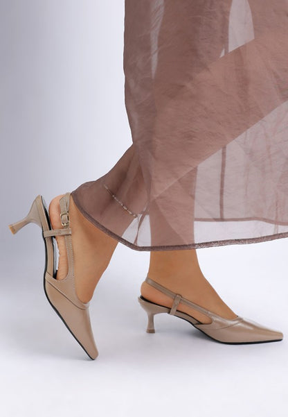 Model side view wearing Luxton Slingback Pin Buckle Kitten Heels in Taupe faux leather finish