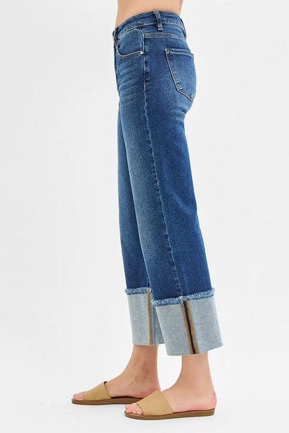 Side view of Desi Mid Rise Crop Wide Cuffed Jeans showing cropped length and cuffed detail.