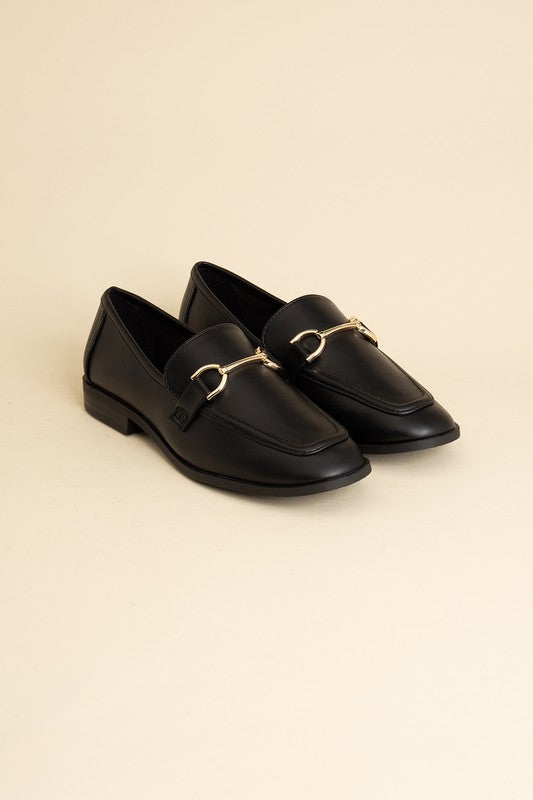 Black Horsebit Loafers with guitar motif, featuring horsebit detailing, slip-on style, and flat heel.