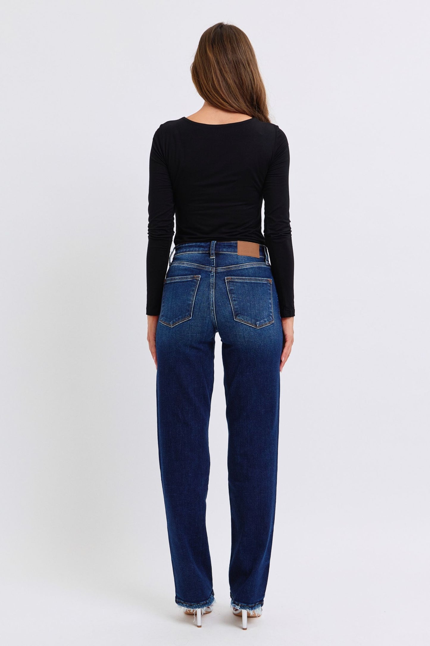 Judy Blue Polly Raw Hem Straight Leg Jeans in dark wash, featuring a mid-rise waist, raw hem, and slightly stretchy fit for a versatile, stylish look.