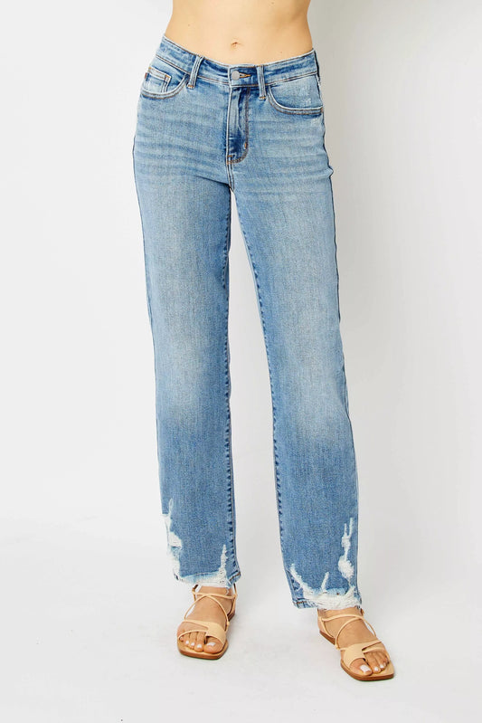 Front view of Estee High Waist Straight Jeans in medium wash with heavy destroy and raw hem.