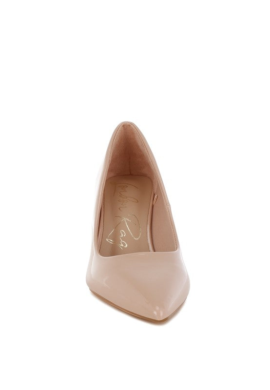 Blush patent leather stiletto heel pumps with a closed point toe. Features a 3-inch stiletto heel, cushioned insole, and made from patent faux leather.