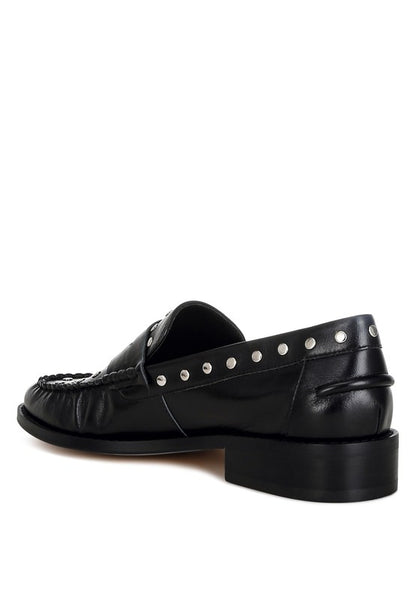 Back angle of Black Oglavia Studded Leather Loafers highlighting block heel and mock stitch detail.