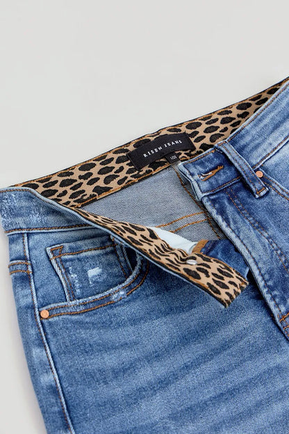 Close-up flat lay of the Allyson wide leg jeans, highlighting the inner waistband with a bold leopard print lining and tummy control band detail.