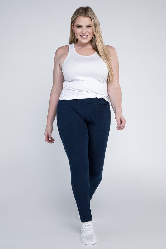 Full-length curvy plus leggings in eclipse blue with a high-rise thick waistband, fitted silhouette, and convenient leg pockets.