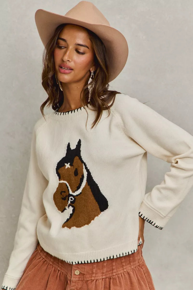 Dolly Horse Knit Sweater Top styled with jeans for a casual equestrian look.