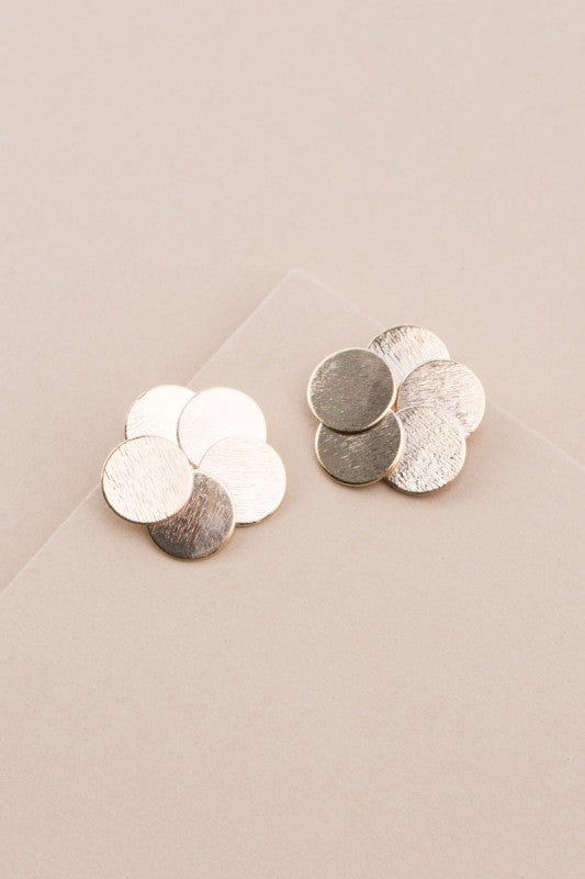 Top view of Round and Round Earrings with overlapping brushed gold discs.