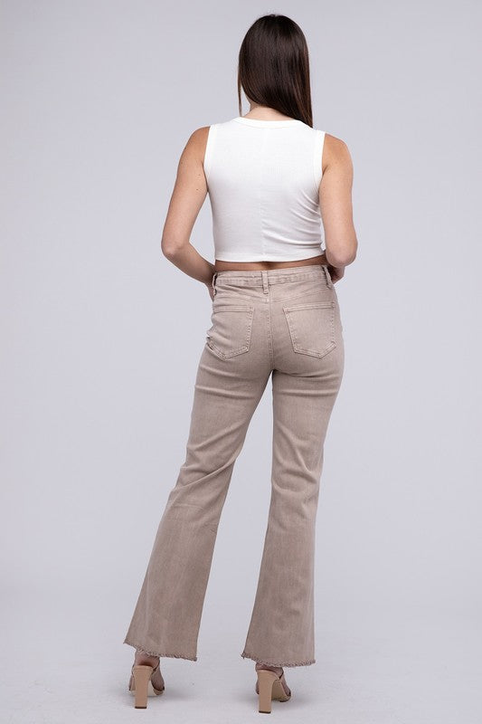 Ash mocha acid-washed straight wide-leg pants featuring a frayed cutoff hem, zip fly closure, and a relaxed fit. Made with stretchy fabric for comfort and a unique vintage-inspired look.