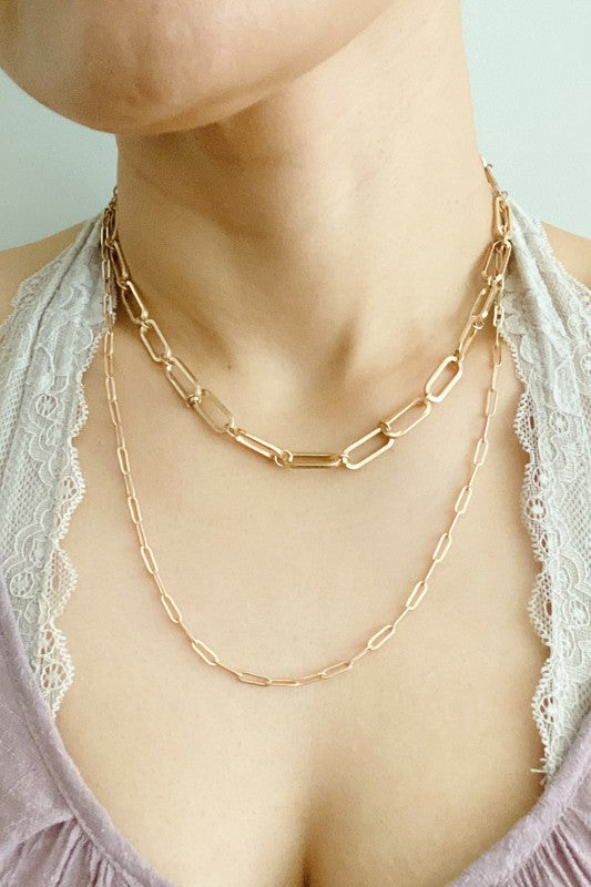 Woman wearing Big & Small Double Chain Link Necklace with layered gold chains