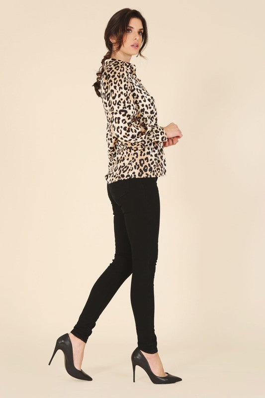 Leopard print satin blouse with a shirt collar, long sleeves, and button-down closure.