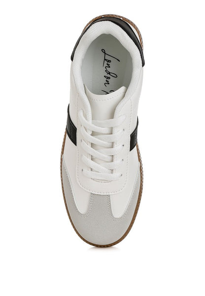 Top view Joelle white crossover sneakers with round toe and contrasting sole.