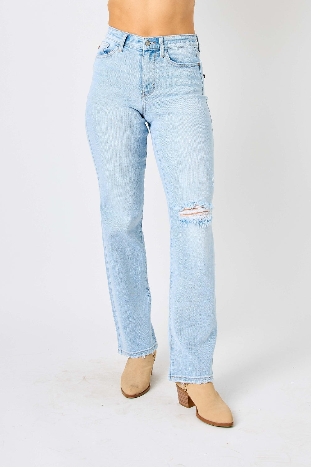 High waist distressed straight jeans in light wash. Slightly stretchy with a zip fly closure.