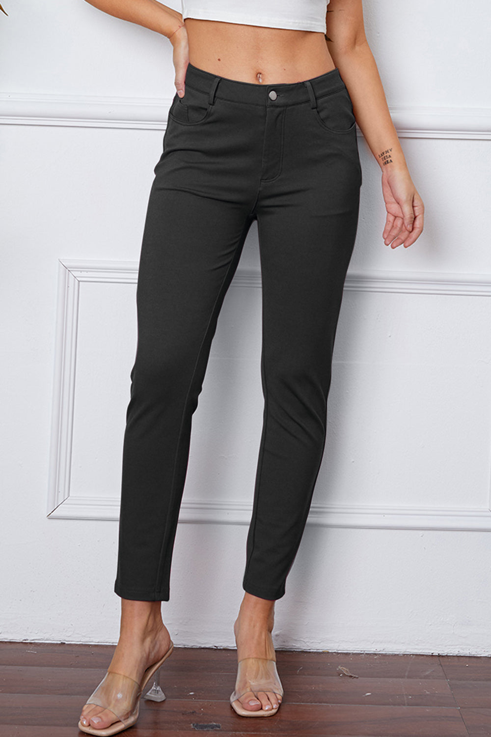 Heather Gray stretchy high-waisted pants feature pockets, a zip fly, and belt loops. 